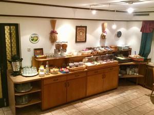 a bakery counter with many different types of food at Landgasthof & Hotel Jossatal in Breitenbach am Herzberg