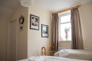 A bed or beds in a room at The Blacksmiths Arms