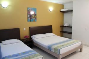Voodi või voodid majutusasutuse Bosque Hotel toas