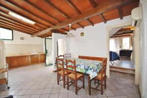 a kitchen and dining room with a table and chairs at Villino Michela in Marina di Pietrasanta