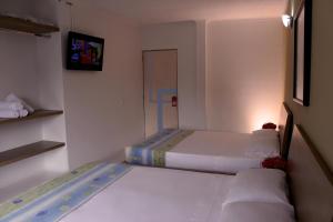 Voodi või voodid majutusasutuse Bosque Hotel toas