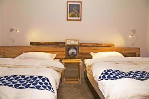 Postel nebo postele na pokoji v ubytování Lijiang Adventure Inn