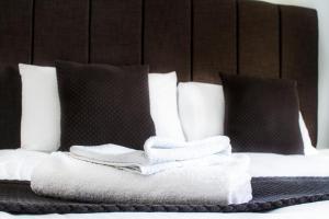 A bed or beds in a room at The Boars Head Hotel 