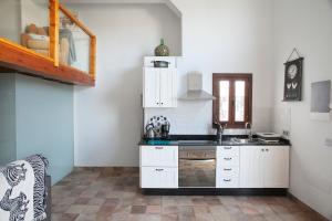 Η κουζίνα ή μικρή κουζίνα στο Caserío Leandro IV +7 φωτογραφίες