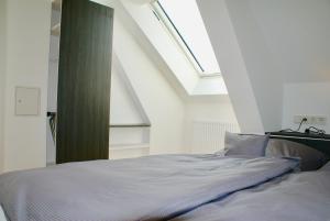 Deichhotel Rose客房内的一张或多张床位