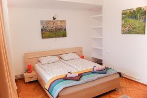 Säng eller sängar i ett rum på Stay Inn Center Timisoara