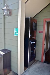 a large refrigerator sitting on the side of a house at Cayucos Sunset Inn in Cayucos