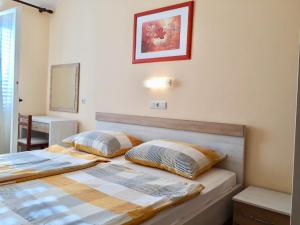 Postel nebo postele na pokoji v ubytování Guest House Sandra