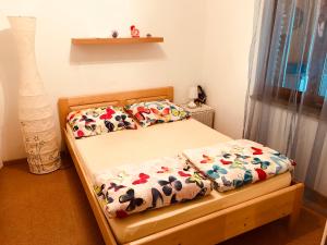 a bedroom with two twin beds with floral sheets at Villa AnaAngela in Malinska