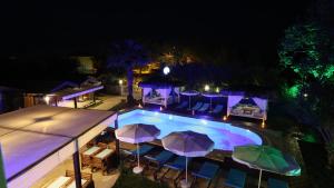 an overhead view of a swimming pool with umbrellas at B&B Boutique Hotel in Dalyan