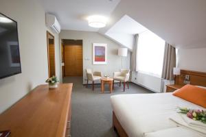Cama o camas de una habitación en Hotel Pod Věží