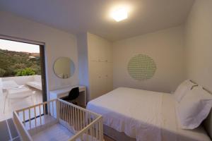 Letto o letti in una camera di Villa Gonia