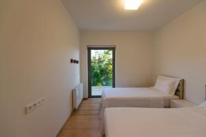 Letto o letti in una camera di Villa Gonia