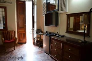 TV a/nebo společenská místnost v ubytování Boutique Hotel Belgica