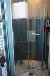 a shower with a glass door in a bathroom at Le Grand Large in Berck-sur-Mer +24 photos