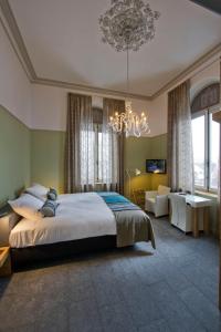 Postel nebo postele na pokoji v ubytování Villa Valkenburg