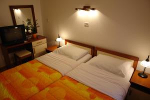 Postel nebo postele na pokoji v ubytování Hotel Fineso