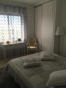Ένα ή περισσότερα κρεβάτια σε δωμάτιο στο Paradise