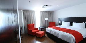 Ένα ή περισσότερα κρεβάτια σε δωμάτιο στο Hotel Classique