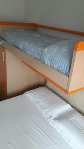 two bunk beds in a room with two beds at Gardens House in Varenna