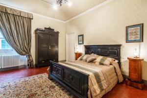 Katil atau katil-katil dalam bilik di Locanda San Marco Residenza Caluri