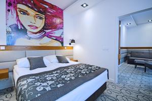 Кровать или кровати в номере Hotel Kozak