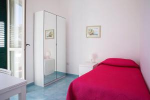 A bed or beds in a room at Dolce Vista Apartment Amalfi Coast
