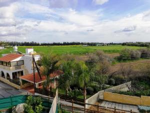 an aerial view of a house and a field at Marlen's Place near Paphos Airport in Paphos City