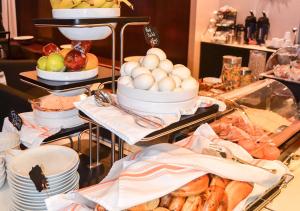 a buffet with eggs and other food on a table at NU Hotel in Brooklyn