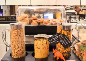 a counter with two containers of food and pastries at NU Hotel in Brooklyn