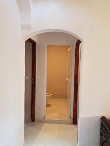 an open hallway with a toilet in a room at Furnished apartments Family only in Tangier