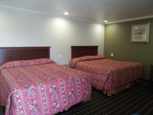 Ліжко або ліжка в номері Castaway Motel