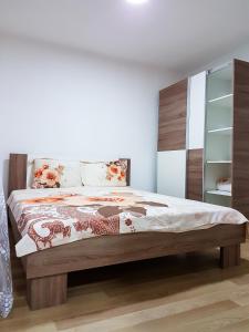 a bedroom with a bed and a book shelf at Venecia Plaza Struga in Struga
