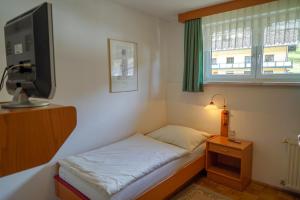 מיטה או מיטות בחדר ב-Gasthof Podobnik