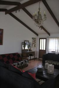 a living room with a couch and a table at Cabañas Lomas del Lago in Frutillar