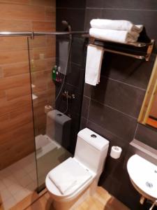 Koupelna v ubytování Qlio Hotel