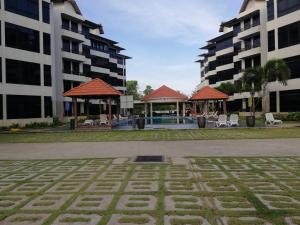 a courtyard in a building with two buildings at Studio at Samsuria Beach Resort in Kampung Sungai Ular