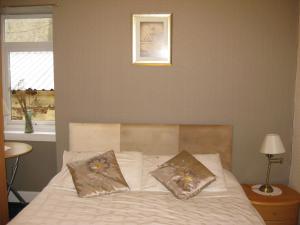 Een bed of bedden in een kamer bij Kilkerran Guest House