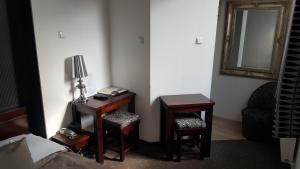 Łóżko lub łóżka w pokoju w obiekcie Hotel Bristol
