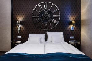 A bed or beds in a room at RQ Boutique & Unique Hotel