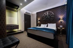 A bed or beds in a room at RQ Boutique & Unique Hotel