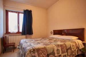 Posteľ alebo postele v izbe v ubytovaní B&B La Bredia