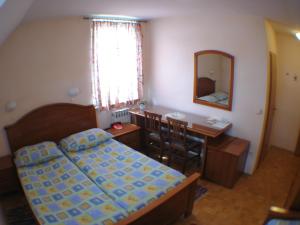 Postel nebo postele na pokoji v ubytování Guesthouse Janez