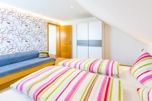 A bed or beds in a room at Haus Margit