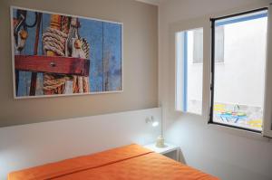 En eller flere senge i et værelse på Torre Chianca GMA Tourism