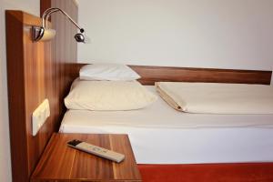 Postel nebo postele na pokoji v ubytování Hotel Meridian ***superior