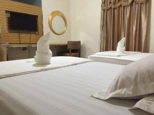 Säng eller sängar i ett rum på Meaco Hotel - Solano