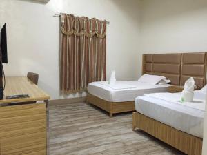 Postel nebo postele na pokoji v ubytování Meaco Hotel - Solano