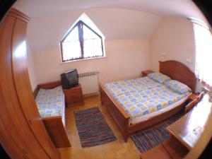 Postel nebo postele na pokoji v ubytování Guesthouse Janez