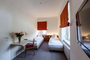 Voodi või voodid majutusasutuse GORITSCHNIGGs Hotel toas